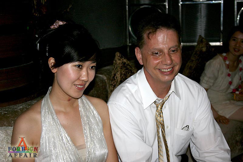 Asian bride with a Western man